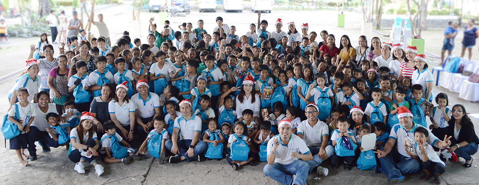 A Season of Giving. Ates and kuyas from Laguna Water bring smiles to more than 150 students of Dambo Elementary School in Pangil, Laguna through its Daloy ng Saya program, an environmental information, education, and communication campaign cum gift-giving activity.