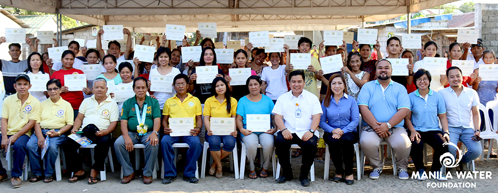 Clean water for all. One hundred household-beneficiaries of Tubig Para Sa Barangay program brandish their Certificate of Water Connection during a turnover ceremony, held March 10, 2016 in Florinda Compound, Brgy.Tubigan Biñan, Laguna.